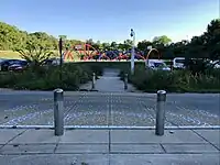 United States: A crosswalk with bollards keeping motor vehicles off the walkway. (Indianapolis, Indiana)