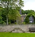 Mounting block with steps on either side at a graveyard (England)