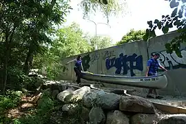 Portages may interface with urban environments. Some include sidewalks or road shoulders.