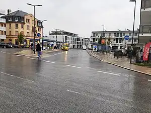 Bahnhofsplatz Bad Vilbel with the bus stop Bad Vilbel, Bahnhof. This small bus station has a parallel road to the main road. Some buses stop at the main road but most most buses stop at this parallel way.