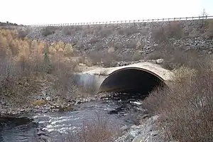 Culvert large enough to contain river rather than drain or stream