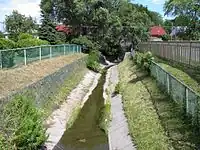 Concrete channel and riverbed of a stream or small river