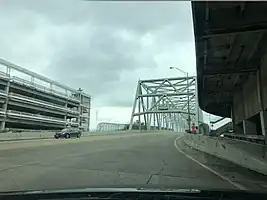 Roof-mounted tornado siren (atop the parking garage) in the United States: emergency=siren siren:purpose=tornado siren:type=electronic direction=90;180 location=roof manufacturer=American Signal Corporation manufacturer:wikidata=Q4744989 siren:model=E-Class [1] support=roof