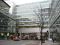 Commercial building across a big road (skipping ground floor). See on OSM