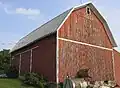 A barn with a gambrel roof