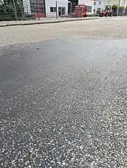 Older section with visible tar/tarmac/bitumen