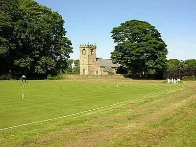 Saint Peter's Church, Rowley, East Riding of Yorkshire. A longer view from the grounds of the Rowley Manor Hotel, across the croquet square!