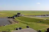 Watergate on the embankment of Dieksanderkoog near Friedrichskoog for boat access