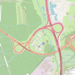 A very unusual double trumpet interchange bundled with a road maintenance facility and police station. Here the notion of "belonging" is more ambiguous and disputable. In this particular case, the link classifications are exceptionally mapped as "split in half", due to different access restrictions and road rules.