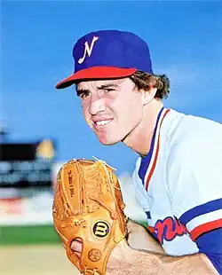 A baseball player in white