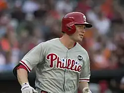 A baseball player in a gray jersey
