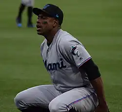 Curtis Granderson crouching in a gray Miami Marlins jersey