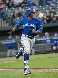 Curtis Granderson running down the first base line in a blue Toronto Blue Jays jersey