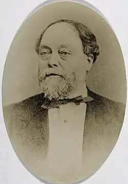 Duncan Curry in a suit and bow tie.