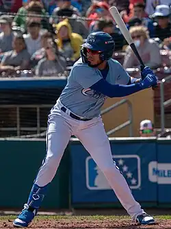 Harold Castro, wearing sunglasses, batting left handed with the Omaha Storm Chasers