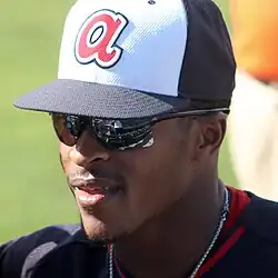 Smith, wearing sunglasses and a Atlanta spring training hat