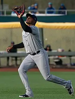 Oscar González of the Columbus Clippers attempting to catch a fly ball