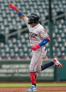 Rodolfo Castro raising his arm and circling the bases after hitting a home run for the Lehigh Valley IronPigs