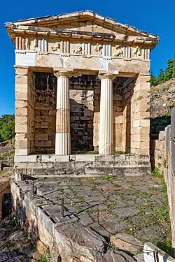 Ancient Greek Doric columns and entablature of the Athenian Treasury, Delphi, Greece, c.525 BC[16]