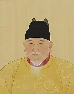 The Hongwu Emperor wears a yellow robe and a black cap.