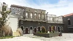 A picture showing the damage to exterior of St. Mary Church of the Holy Belt during the Syrian Civil War