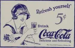 Coca Cola advertisement of a woman holding a glass