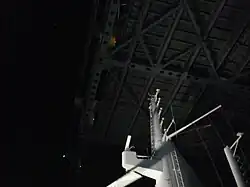 The Queen Mary 2 radar mast passing under the Verrazzano Bridge
