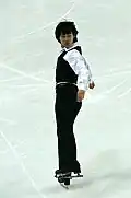 Denis Ten sets up for a jump.