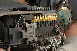 30mm × 113&nbsp;mm rounds being loaded into a M230 chain gun