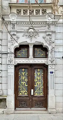 Door of Piața Mihail Kogălniceanu no. 7 in Bucharest, unknown architect (c. 1900)