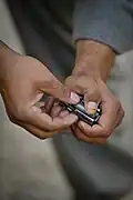 Loading 7.62×39&nbsp;mm ammunition into an AK magazine