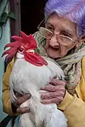 Woman with her pet rooster, Cuba