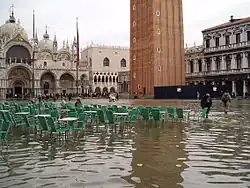 Tidal flooding. Sea-level rise increases flooding in low-lying coastal regions. Shown: Venice, Italy (2004).[272]