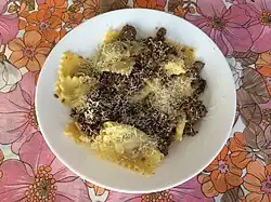 A dish of dry Pavese agnolotti, a type of stuffed pasta, with a Pavese stew-based sauce