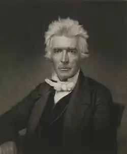 19th-century Christian religious leader Alexander Campbell shown with spiky, white hair. He is looking directly towards the viewer. He is wearing a dark coat, black vest, and a white shirt secured by a white cravat.