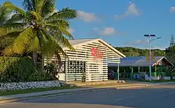 Alofi locals walking along a street