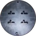 Front side of a four-family die. The die is 228&nbsp;mm (9.0&nbsp;in) in diameter.