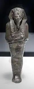 Ushabti of Amenhotep II; 1427–1400&nbsp;BC; serpentine; 29 × 9 × 0.65&nbsp;cm, 1.4&nbsp;kg; British Museum (London)