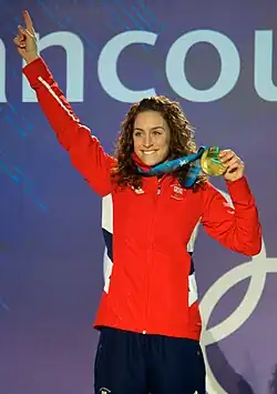 Woman celebrating victory in sports competition.