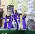 The female students wearing purple Áo dài