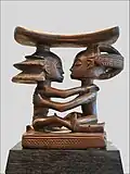 Headrest; by artists of the Luba people; 19th century; wood; height: 18.5&nbsp;cm; Musée du quai Branly (Paris)[111]