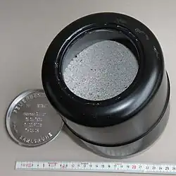 An open ash capsule showing the remains of the dead