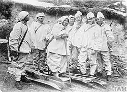 Austro-Hungarian ski patrol in two-part snow uniforms with improvised head camouflage on Italian front, 1915–1918