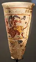 Goblet showing The Rape of Europa and of Ganymede, part of the Bagram Treasure; 1st century AD; painted glass; height: 16&nbsp;cm, diameter: 10&nbsp;cm; Guimet Museum (Paris)[86]