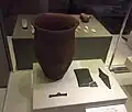 Beaker, wrist-guard with gold studs, copper dagger and toggle.[207]