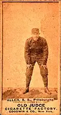 Sepia-tone baseball card of Bob Allen bent over, by the Old Judge Cigarette Factory