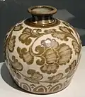 Chinese ding-ware porcelain bottle with iron-tinted pigment under a transparent colorless glaze, 11th century, Song dynasty