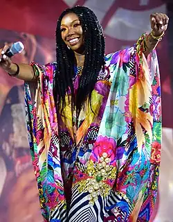 Brandy smiling while performing