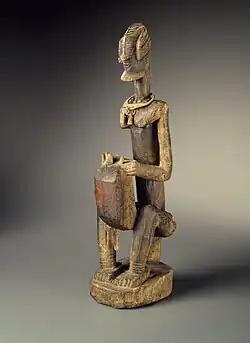 Figure of a seated musician (koro player); late 18th century; 55.8 x 17.7 x 10.8&nbsp;cm (22 x 7 x 41⁄4 in.); Brooklyn Museum (New York City)