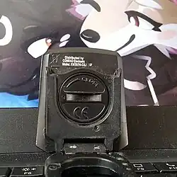 Coin slot-style screw head on a battery holder, capable of being opened using the CR2032 battery.